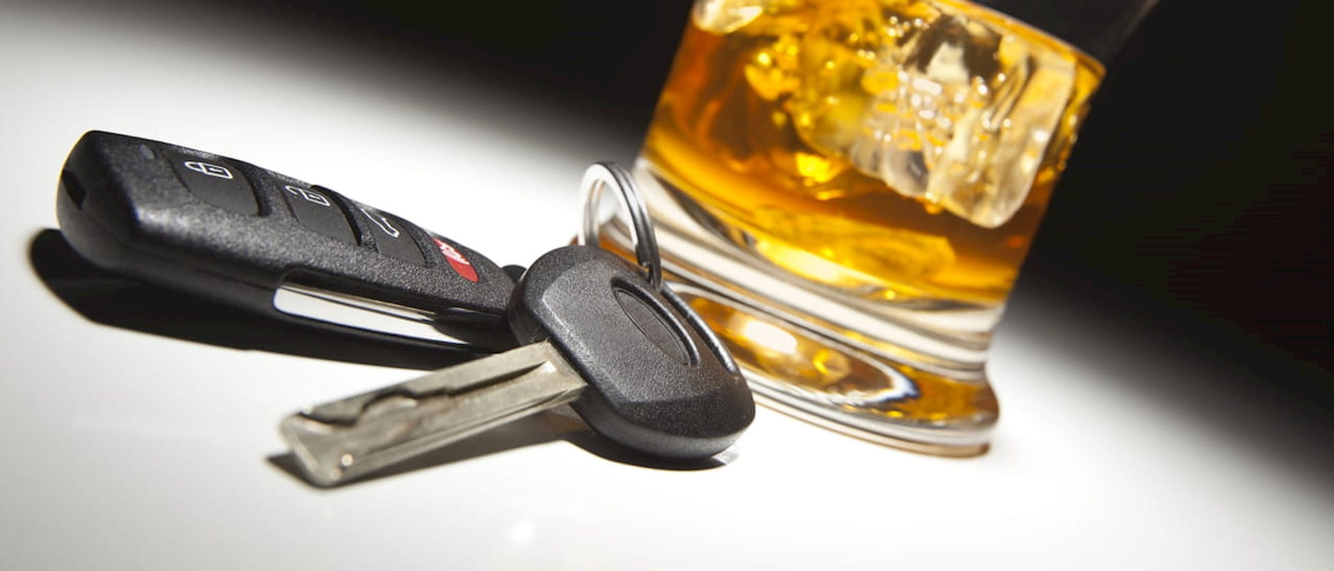 Car keys and a whisky glass