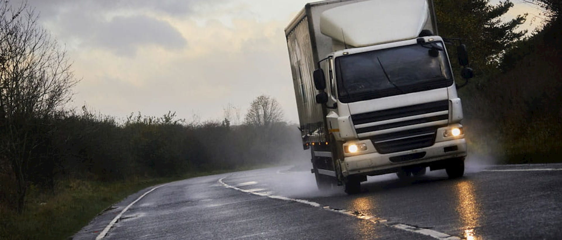 Lorry driving on wet road
