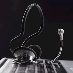 Telephone headset on laptop keyboard