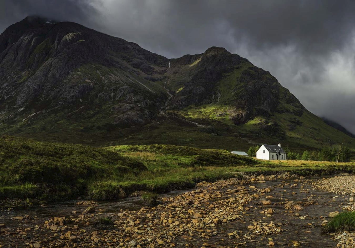 Photograph of white house in Scottish mountains