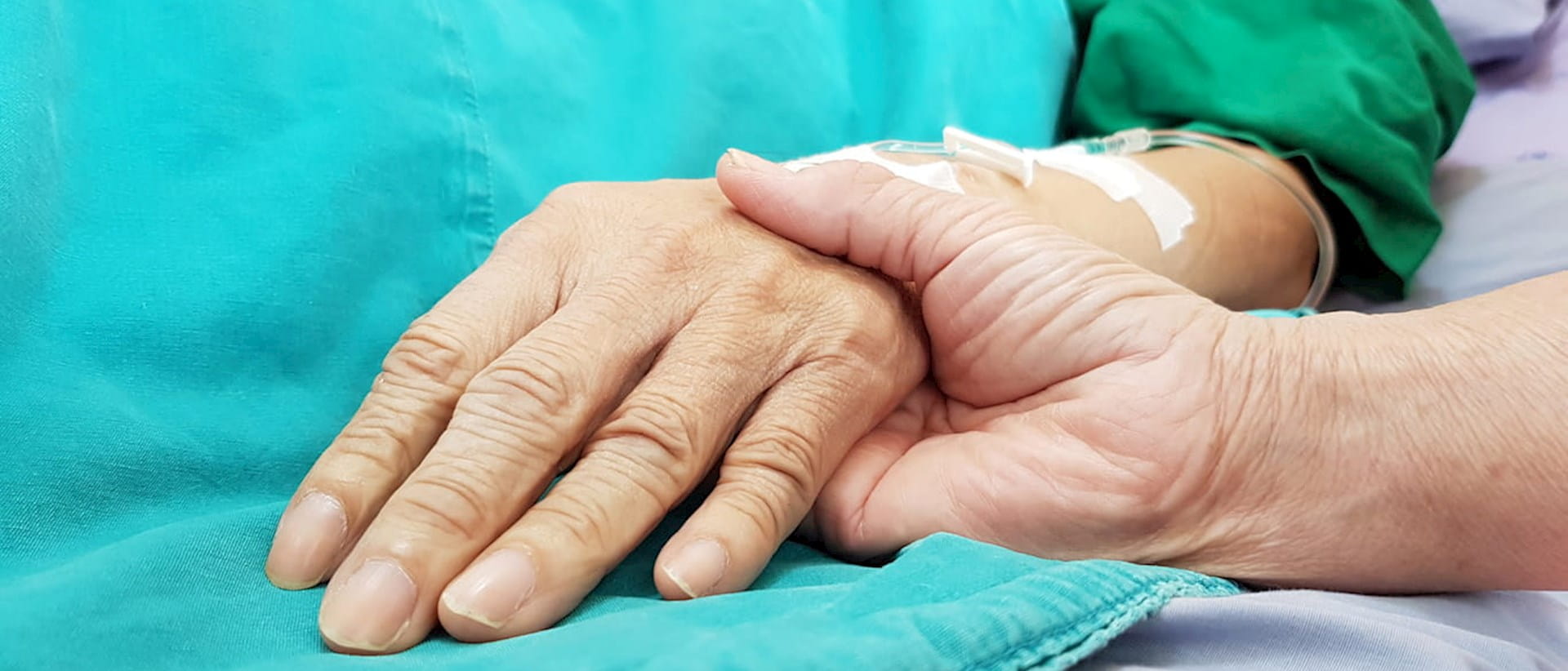 Holding patient's hand