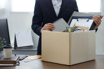 Office worker packing box