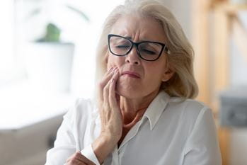 Woman with sore jaw