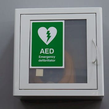 Photograph of defibrillator box on wall