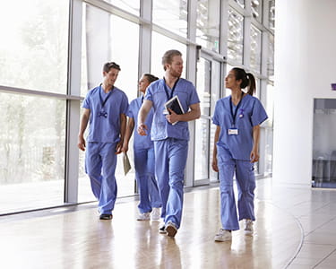 Doctors walking in hospital corridor