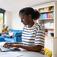 Woman typing on laptop